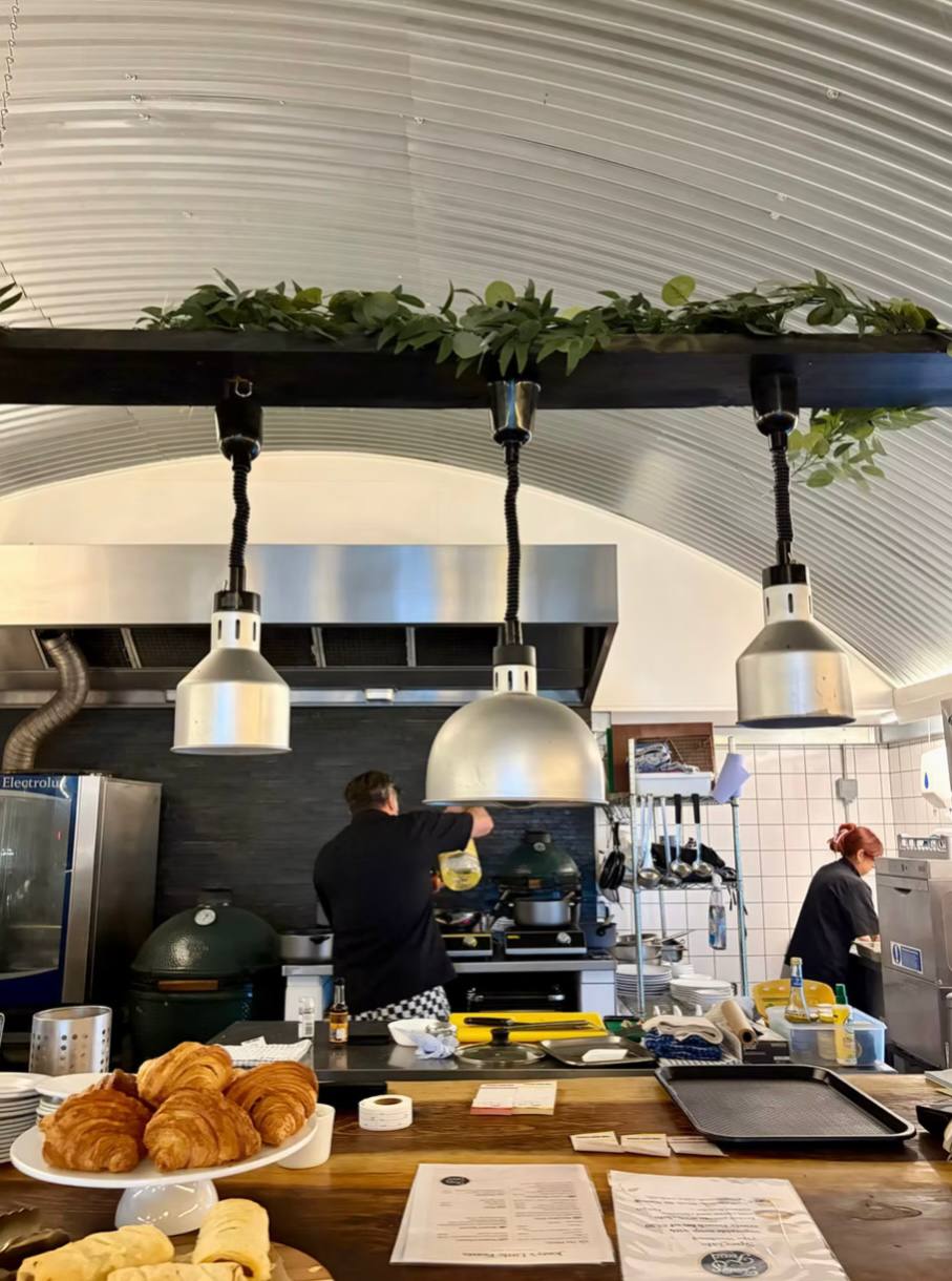 Open kitchen with heat lamps at Chart Farm